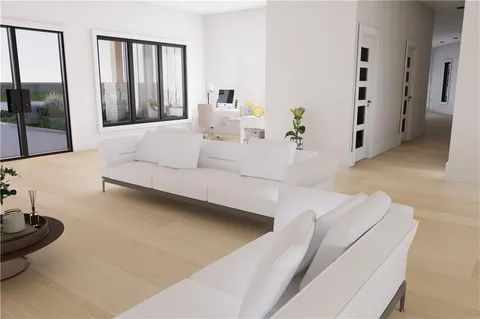 a living room with furniture and large windows