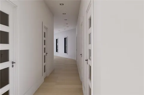 a view of a hallway with a white door