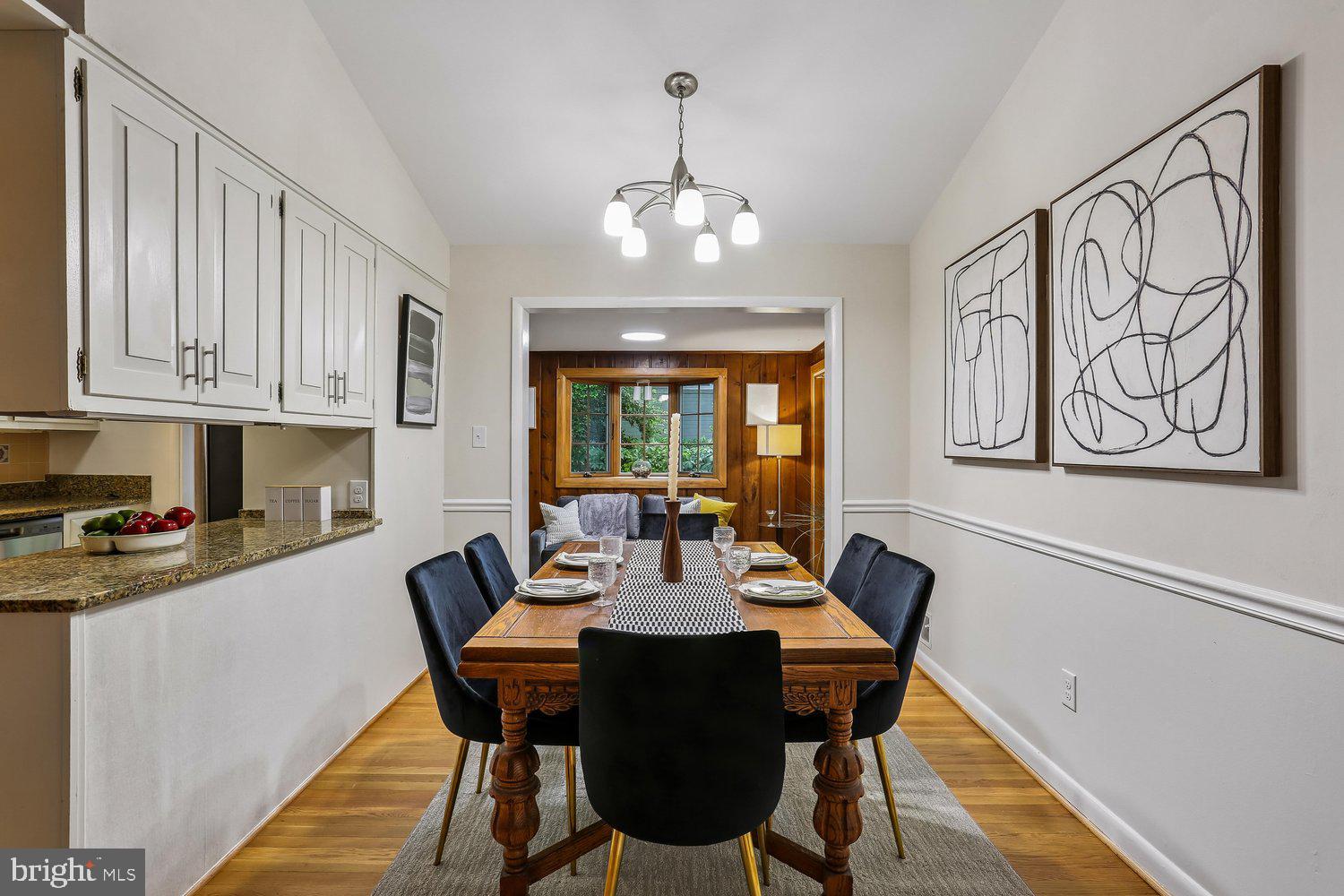 907 Hoyt Street Silver Spring, MD 20902 - Photo 10 of 69 a view of a dining room with furniture window and wooden floor