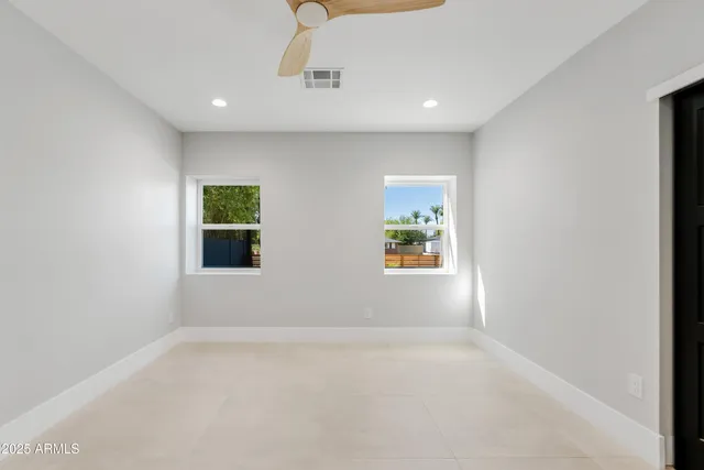 an empty room with windows