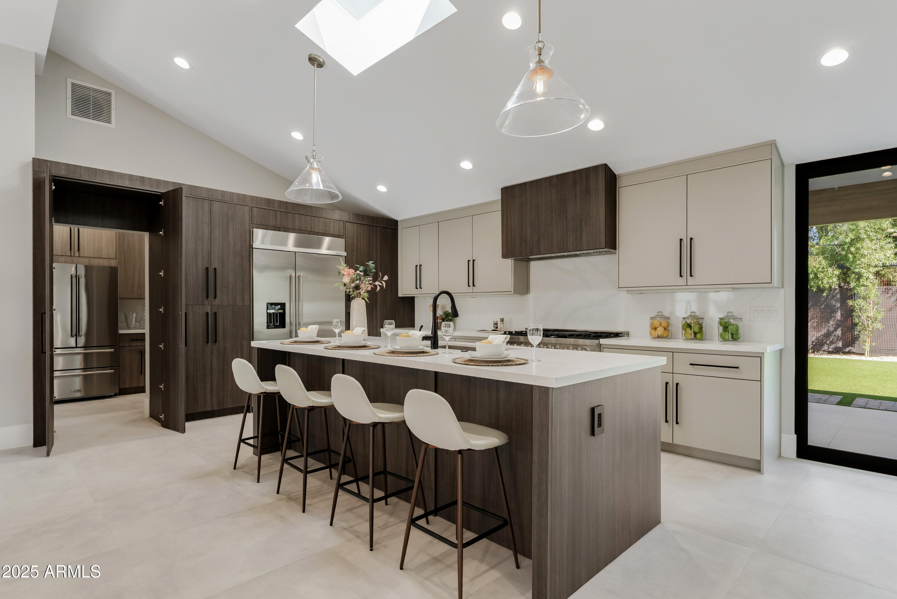 7717 North 7th Avenue Phoenix, AZ 85021 - Photo 2 of 26 a kitchen that has a lot of cabinets in it and appliances