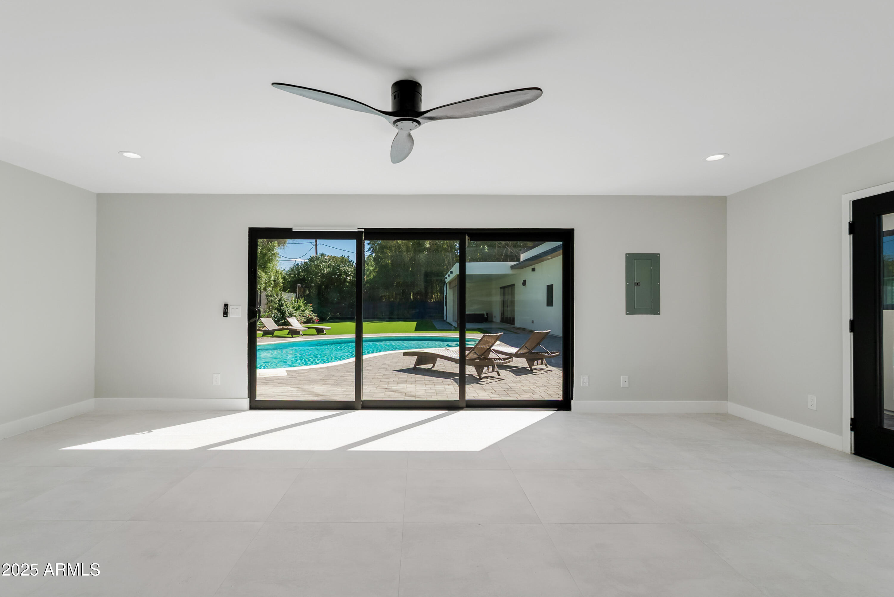 7717 North 7th Avenue Phoenix, AZ 85021 - Photo 24 of 26 a view of an empty room with a sliding door