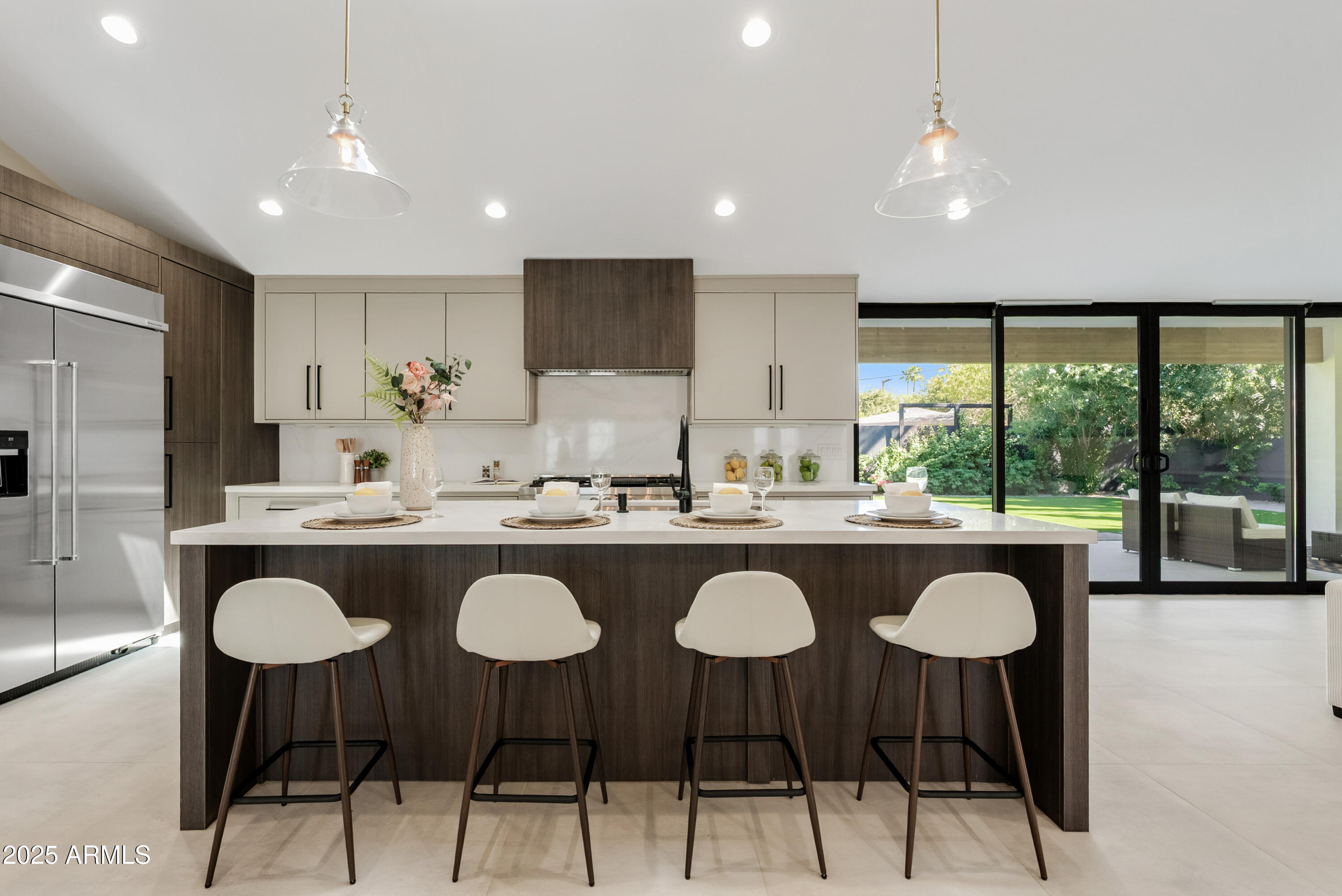 7717 North 7th Avenue Phoenix, AZ 85021 - Photo 3 of 26 a kitchen with kitchen island granite countertop a sink and a stove