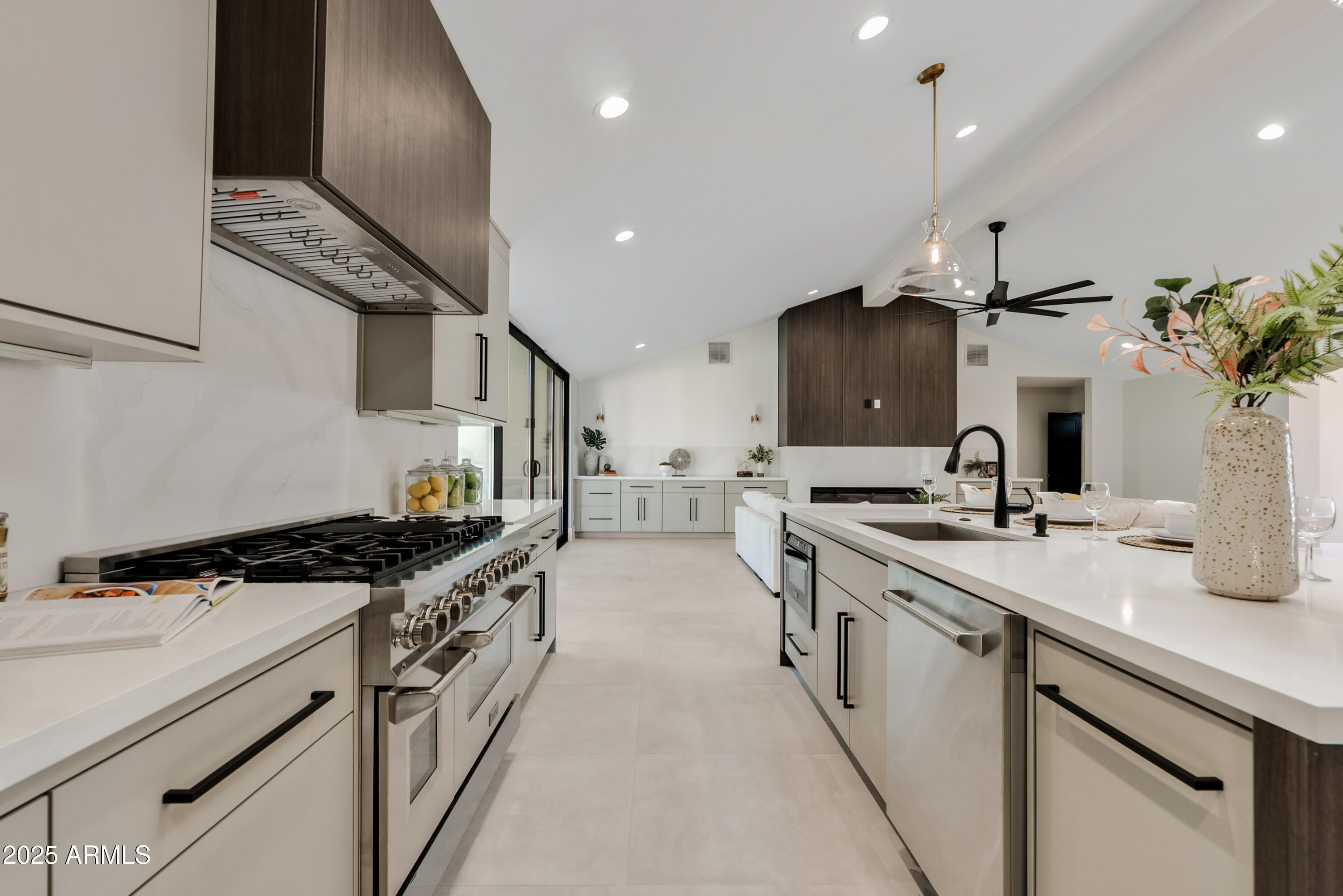 7717 North 7th Avenue Phoenix, AZ 85021 - Photo 4 of 26 a kitchen with stainless steel appliances a sink stove and cabinets