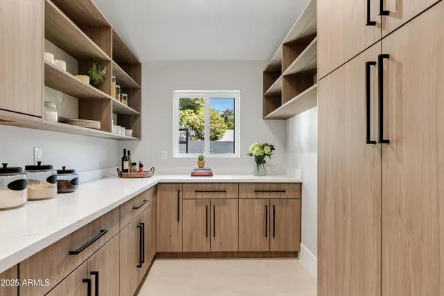 a kitchen with stainless steel appliances a sink and cabinets