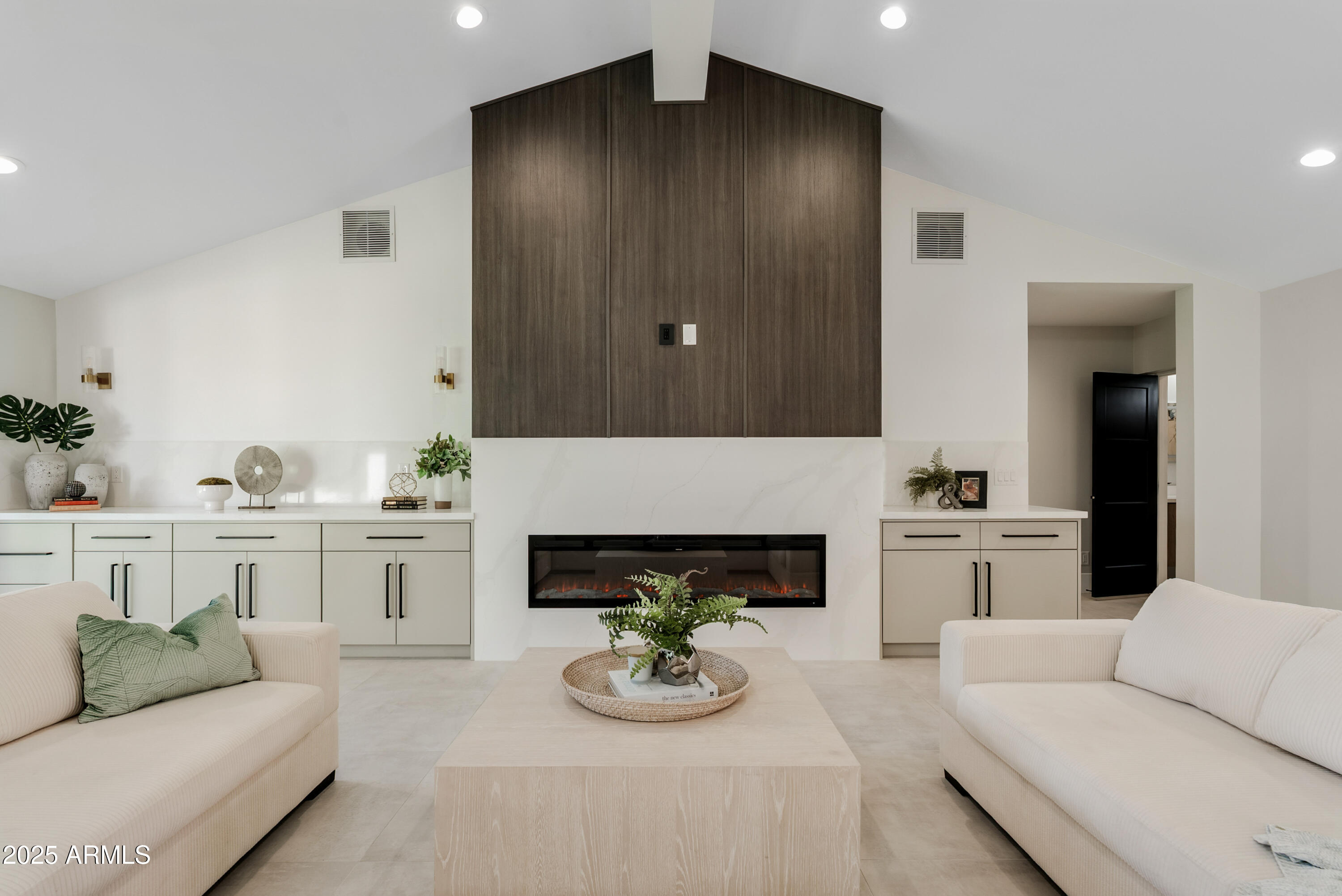 7717 North 7th Avenue Phoenix, AZ 85021 - Photo 8 of 26 a living room with furniture and a fireplace