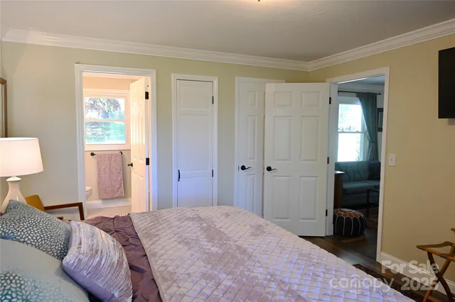 a bedroom with a bed and a walk in closet