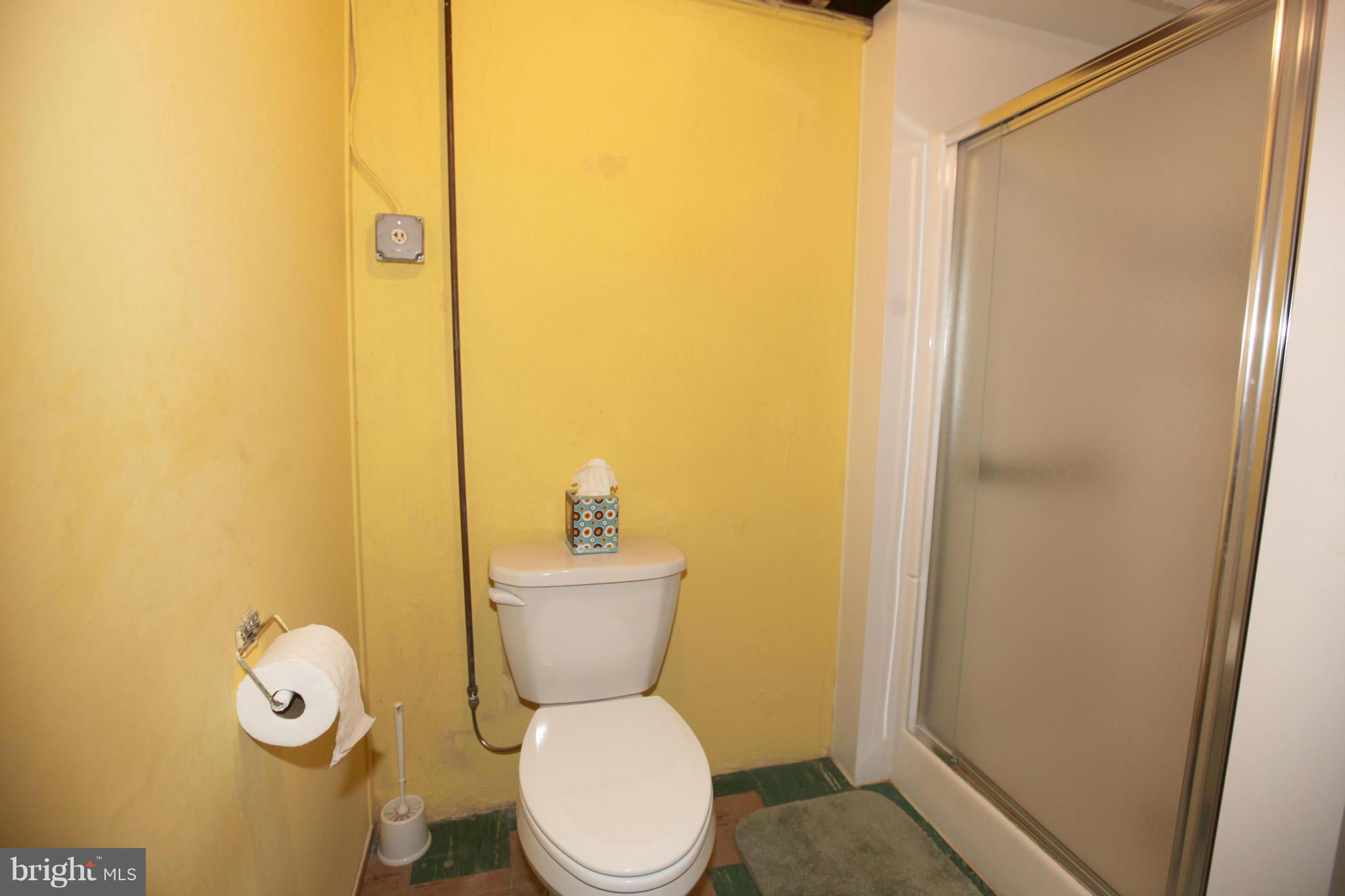 1808 Willann Road Baltimore, MD 21237 - Photo 20 of 23 a white toilet sitting next to a bathroom sink