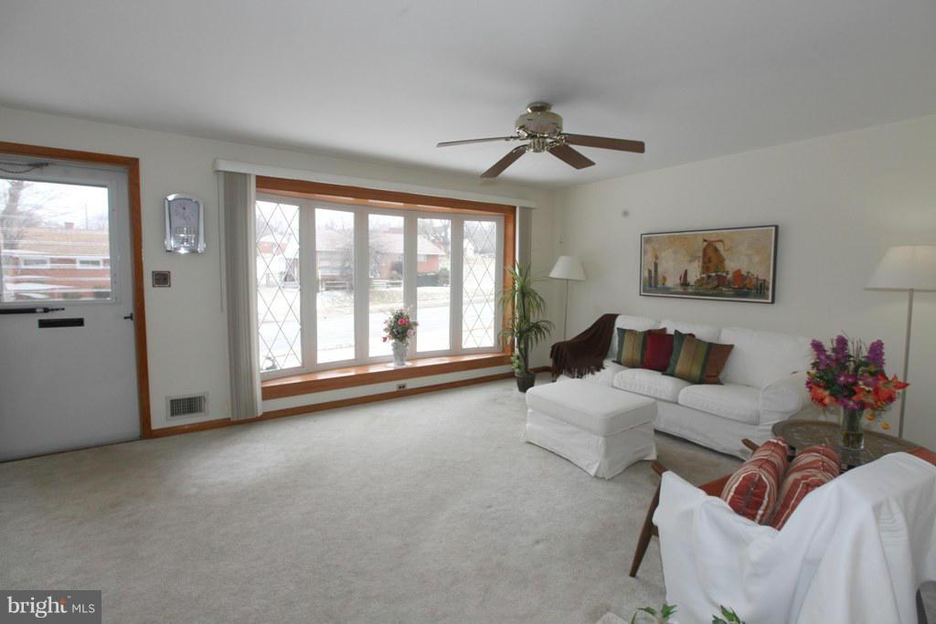1808 Willann Road Baltimore, MD 21237 - Photo 4 of 23 a living room with furniture and a large window