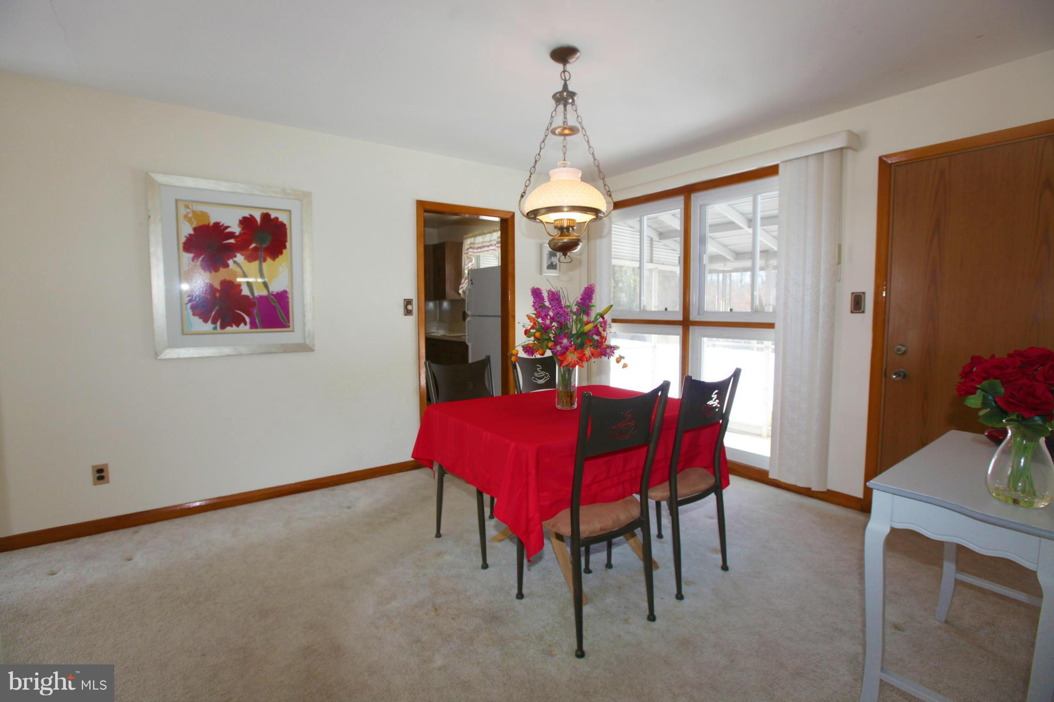 1808 Willann Road Baltimore, MD 21237 - Photo 5 of 23 a view of a dining room with furniture window and outside view