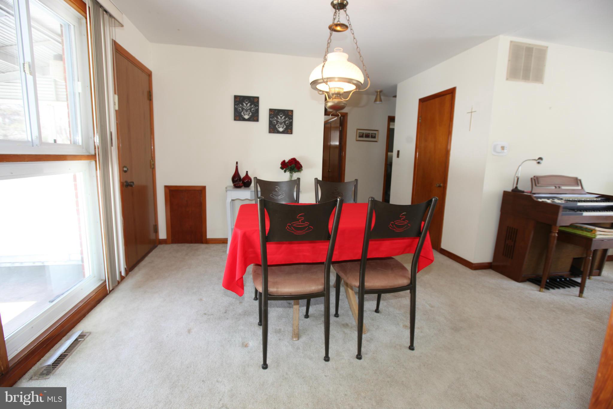 1808 Willann Road Baltimore, MD 21237 - Photo 10 of 23 a view of a dining room with furniture and window