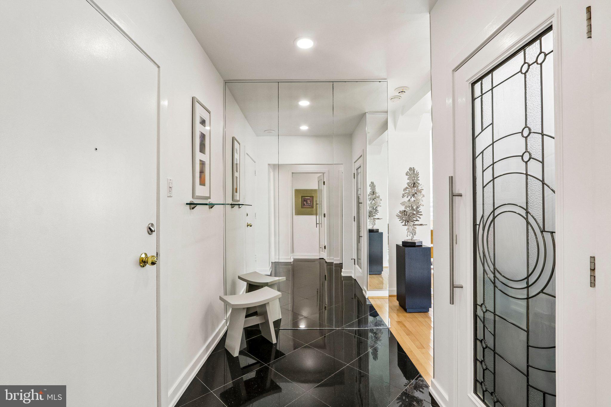220 West Rittenhouse Square, Unit 10C Philadelphia, PA 19103 - Photo 29 of 39 a bathroom with a granite countertop sink a toilet and shower