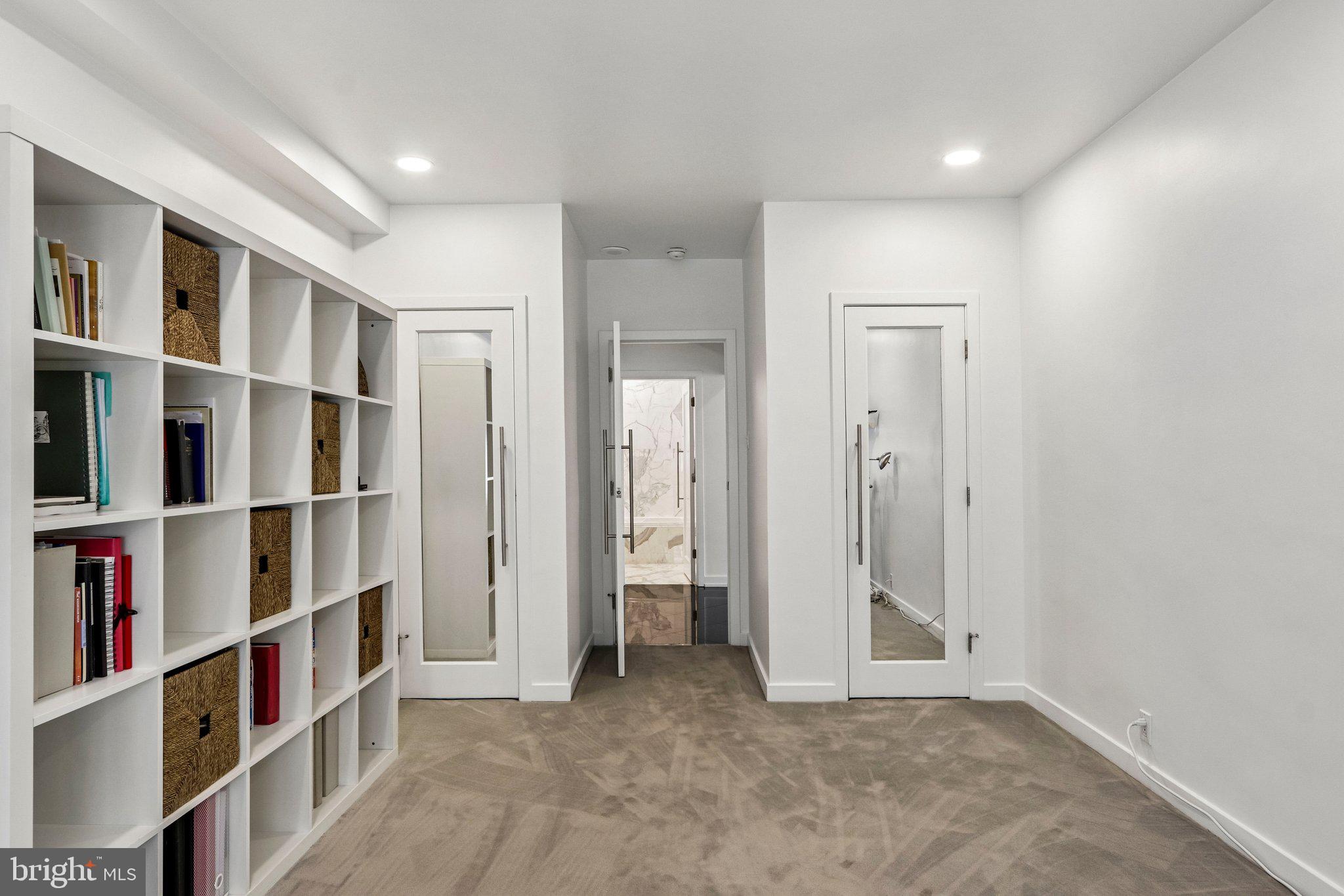 220 West Rittenhouse Square, Unit 10C Philadelphia, PA 19103 - Photo 31 of 39 an empty room with shelves