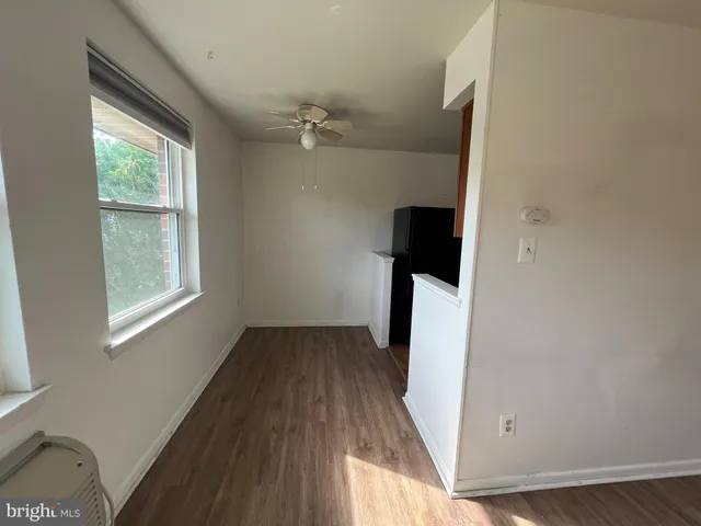 a kitchen with stainless steel appliances granite countertop a sink a stove a refrigerator a microwave and cabinets