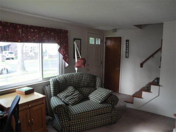 27 Campechi Street Springfield, MA 01104 - Photo 5 of 17 a living room with furniture and a window