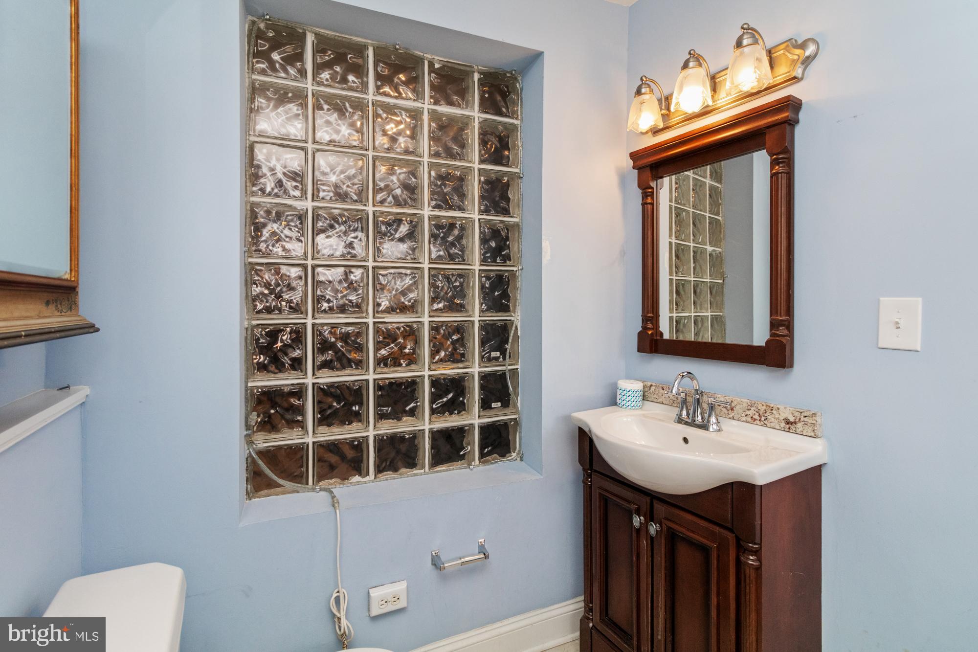 1812 Light Street Baltimore, MD 21230 - Photo 14 of 45 a bathroom with a sink and a mirror