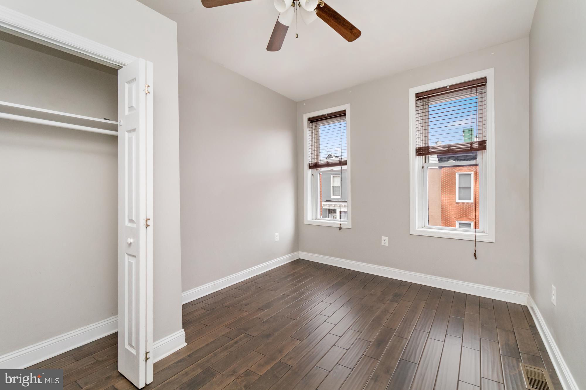 1812 Light Street Baltimore, MD 21230 - Photo 16 of 45 wooden floor in an empty room with a window
