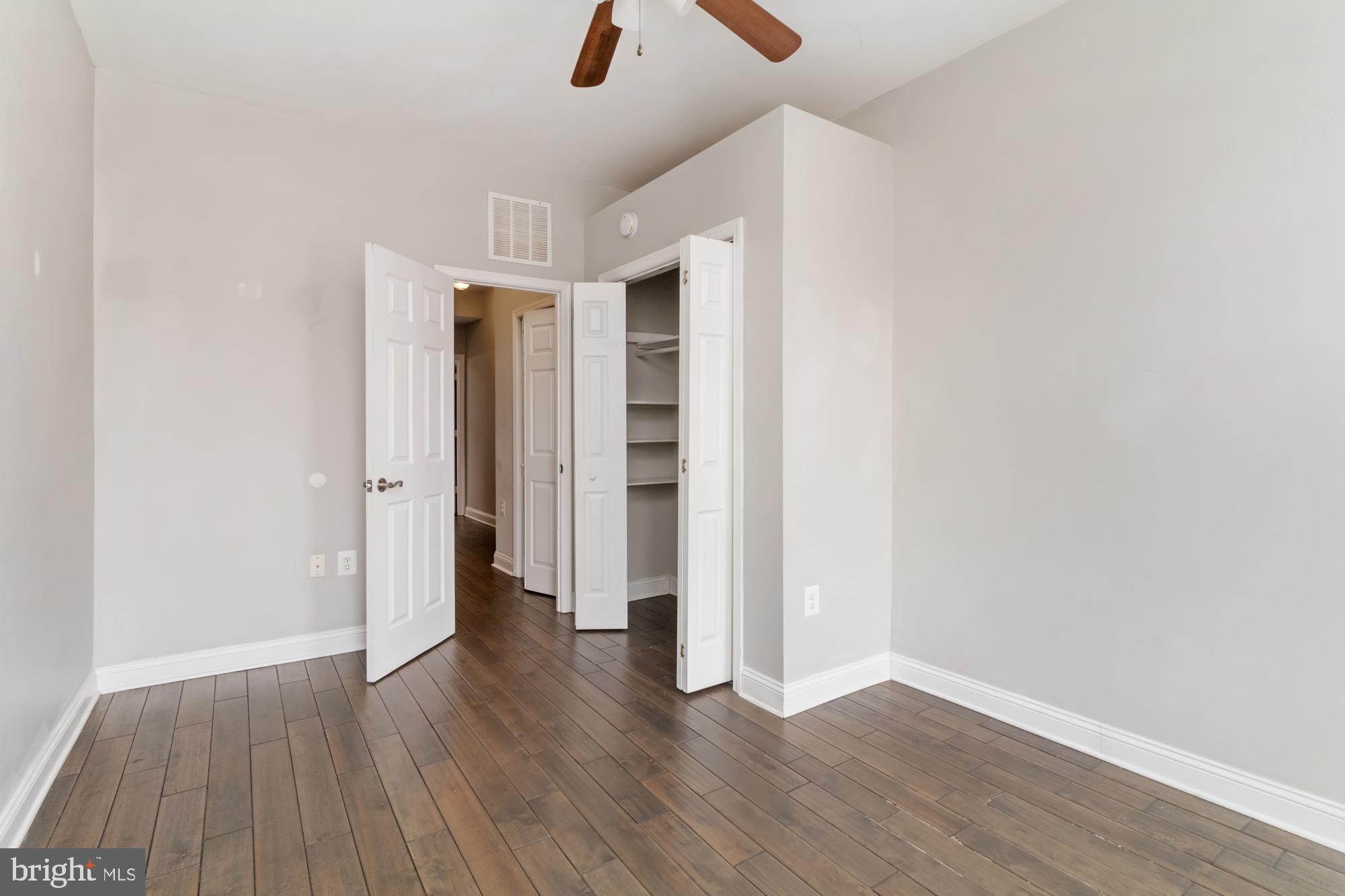 1812 Light Street Baltimore, MD 21230 - Photo 17 of 45 an empty room with wooden floor and closet