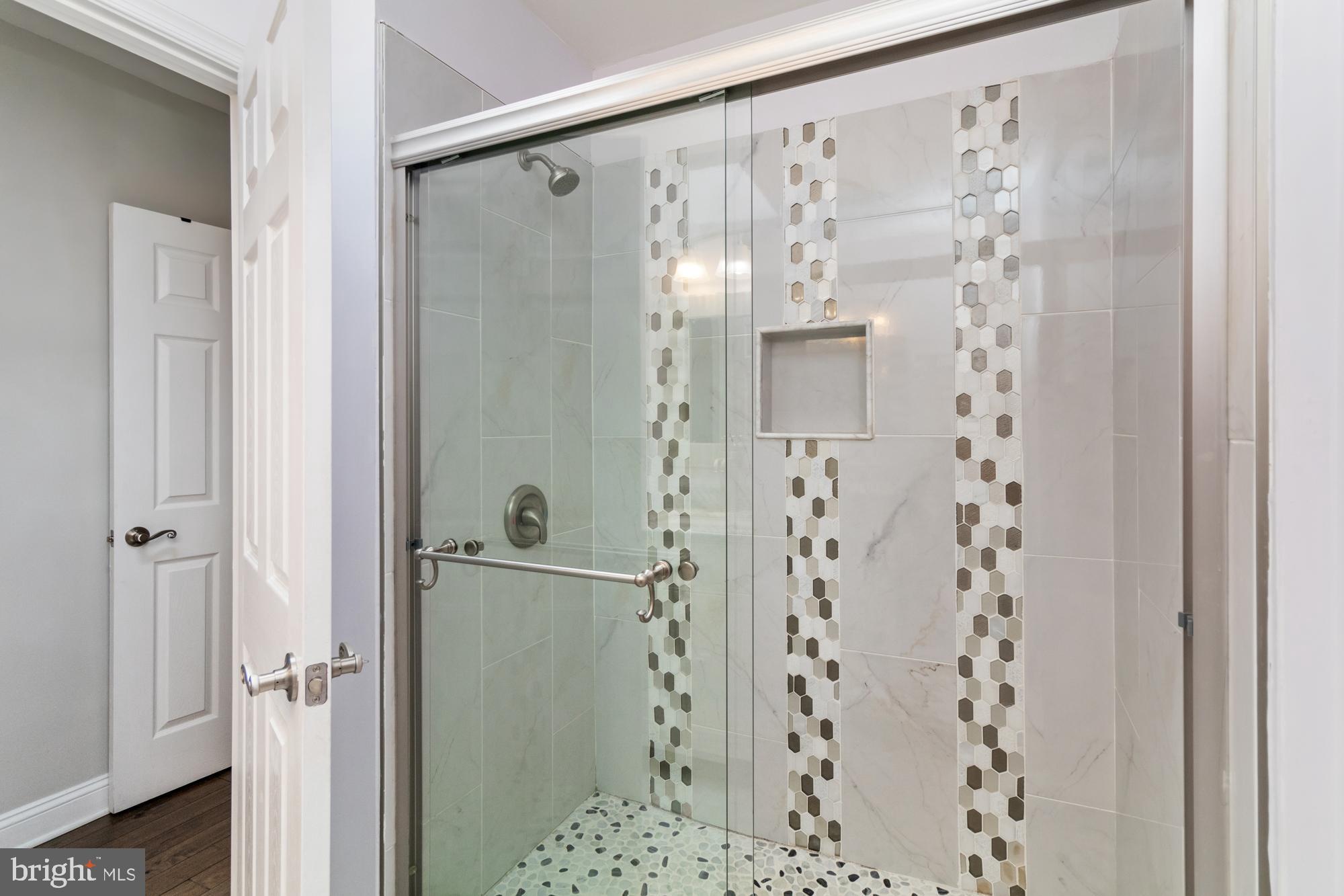 1812 Light Street Baltimore, MD 21230 - Photo 25 of 45 a bathroom with a shower and a mirror