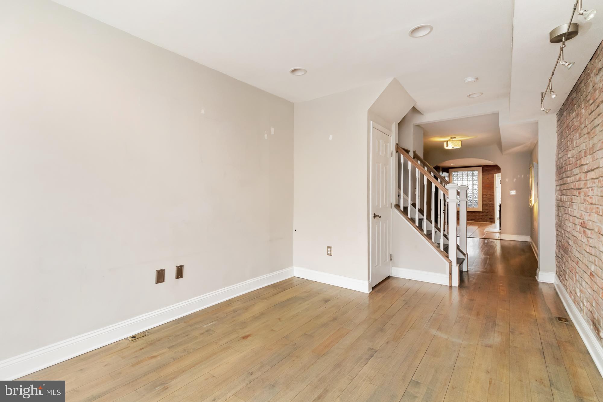 1812 Light Street Baltimore, MD 21230 - Photo 4 of 45 a view of a hallway with wooden floor