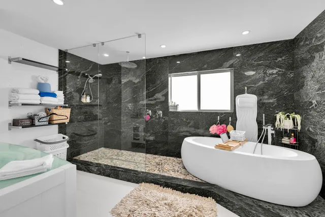 a bathroom with a shower and a sink