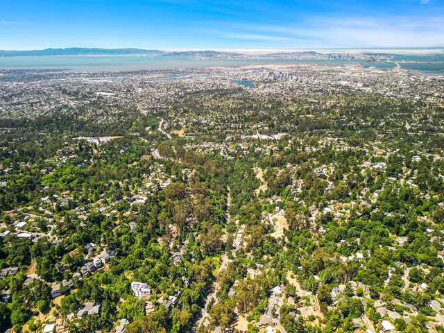 an aerial view of residential building and ocean