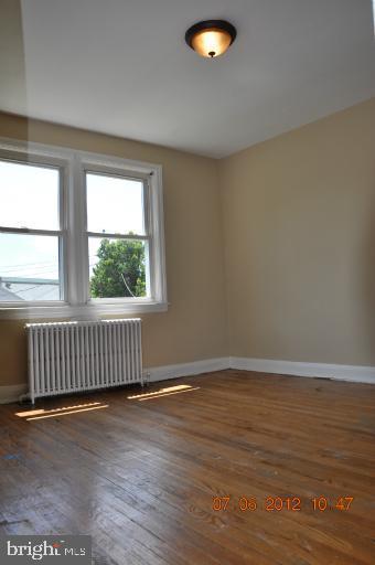 4015 Edgewood Road Baltimore, MD 21215 - Photo 3 of 4 Master bedroom ignore radiators