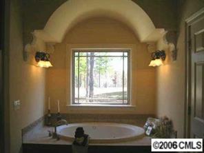 1204 Broadside Road York, SC 29745 - Photo 6 of 8 a bathroom with a sink and a bathtub