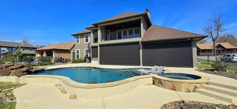127 Bridgewater Onalaska, TX 77360 - Photo 31 of 34 a view of a house with swimming pool and porch