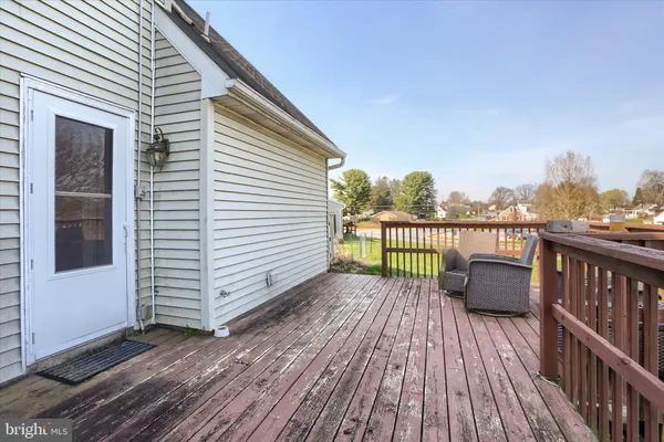 a balcony with wooden floor