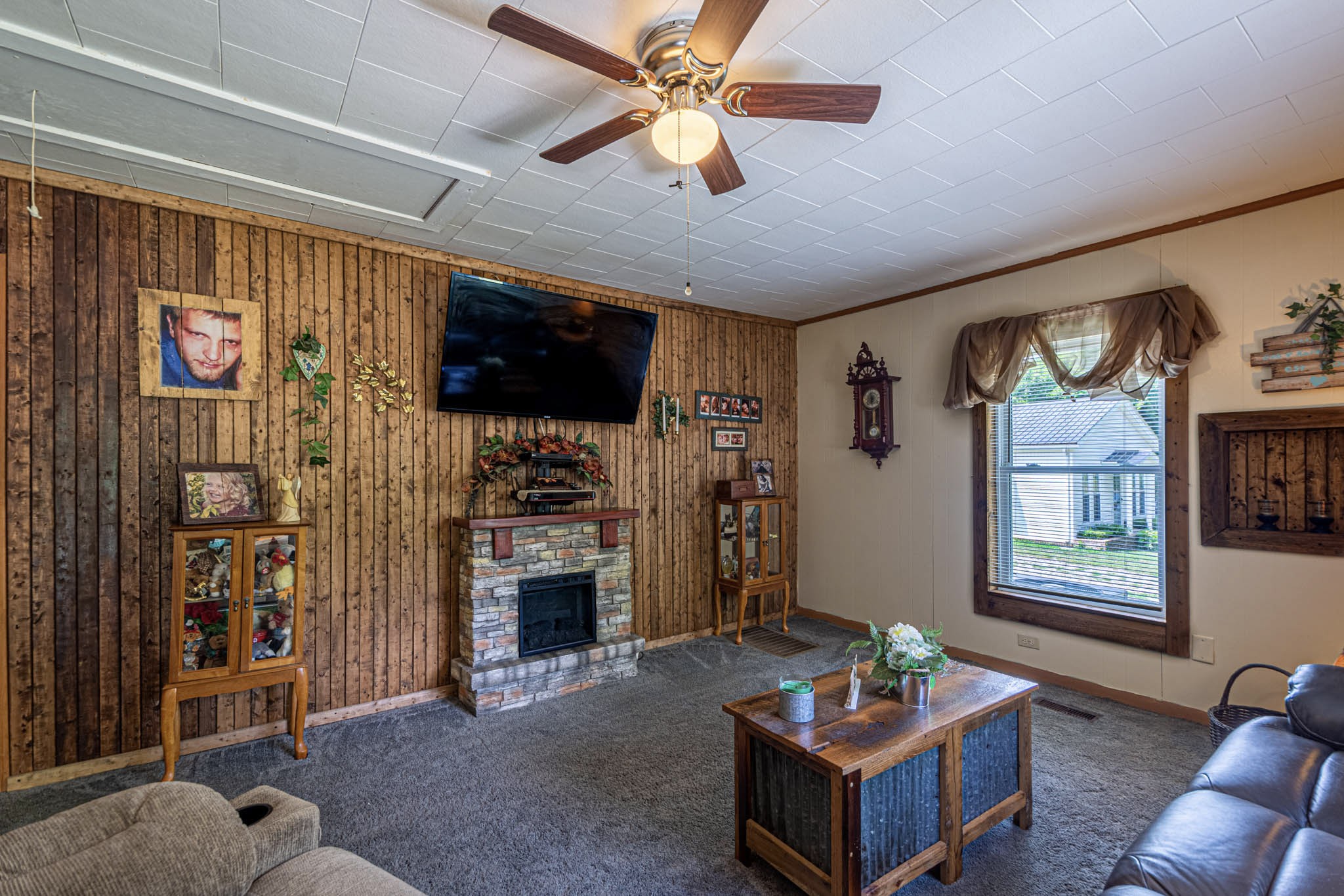7091 Morgan Creek Road Centerville, TN 37033 - Photo 8 of 55 a living room with furniture a flat screen tv and a fireplace
