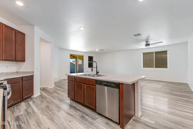 a kitchen with a sink and cabinets