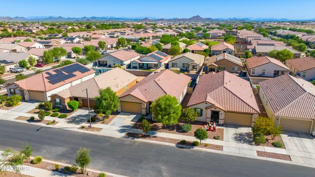 an aerial view of residential houses with outdoor space