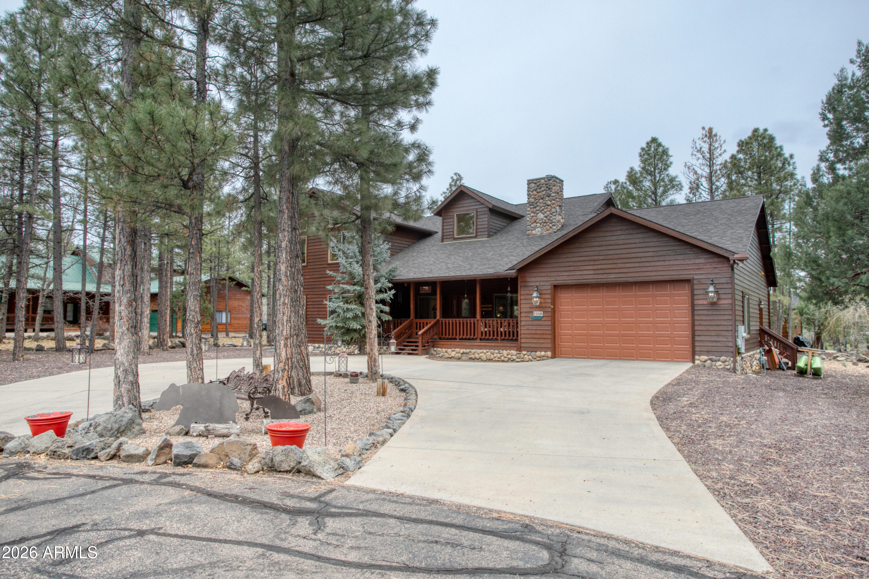 826 Pine Creek Circle Lakeside, AZ 85929 - Photo 8 of 68 a front view of a house with a yard outdoor seating and covered with trees