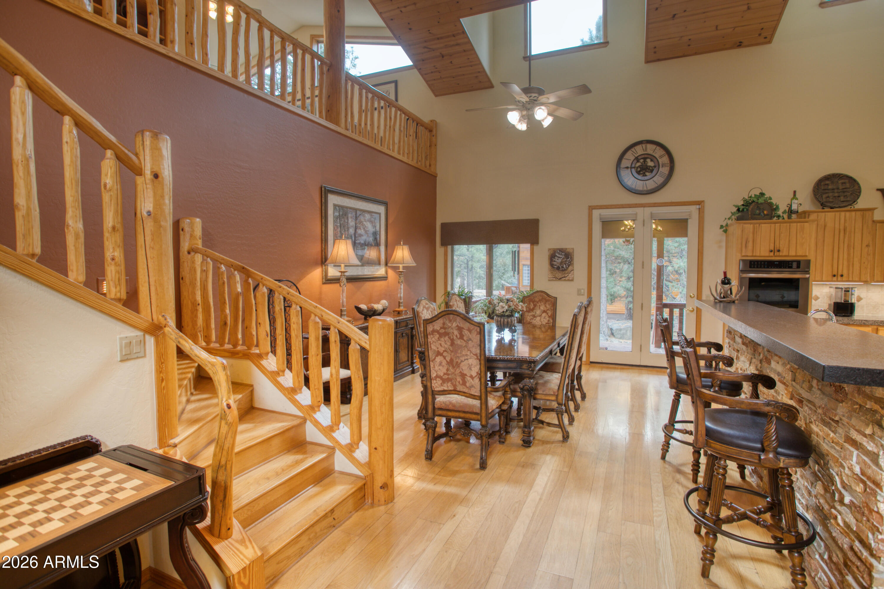 826 Pine Creek Circle Lakeside, AZ 85929 - Photo 12 of 68 a view of a dining room with furniture window and wooden floor