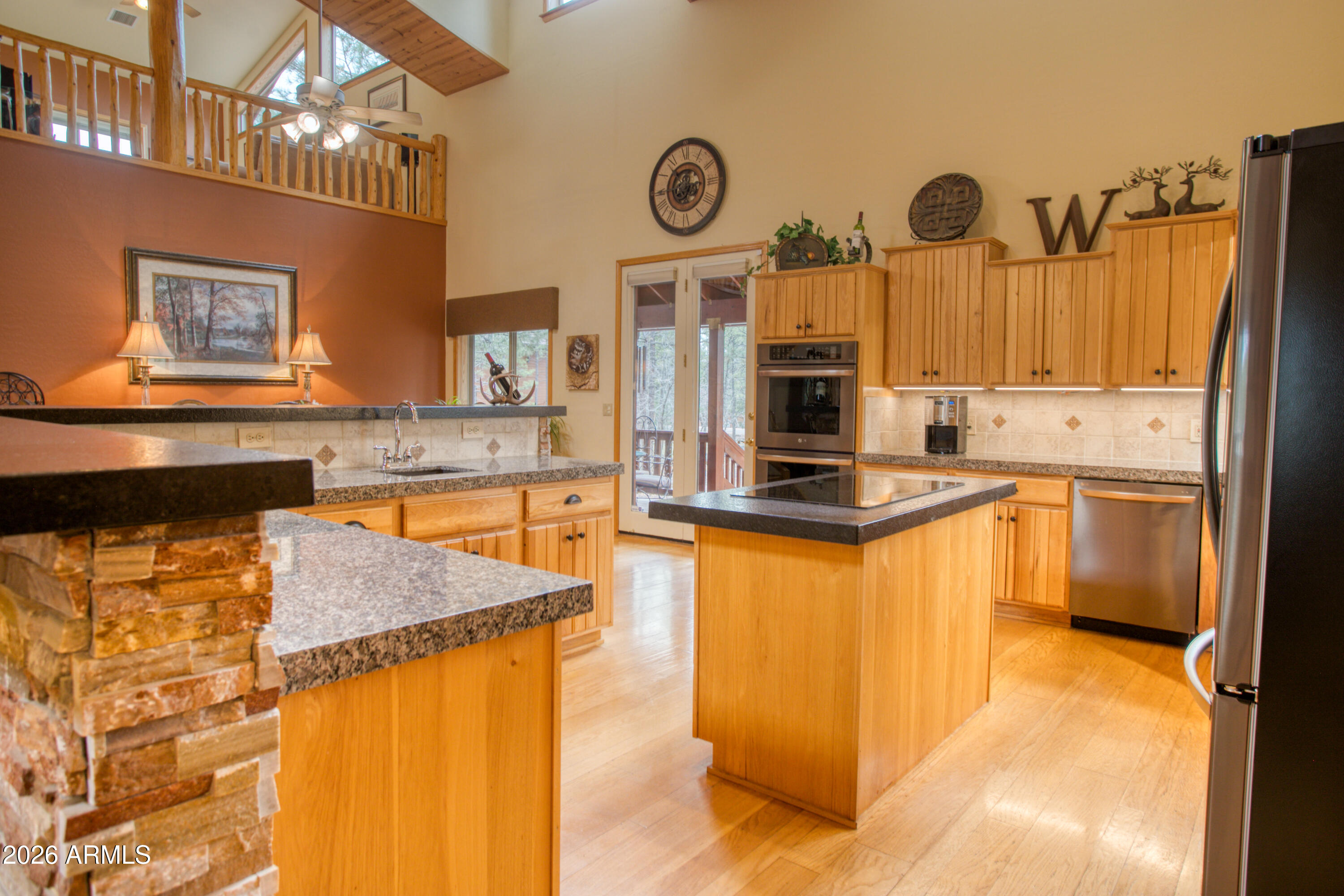 826 Pine Creek Circle Lakeside, AZ 85929 - Photo 13 of 68 a kitchen with stainless steel appliances granite countertop a sink a stove and a refrigerator
