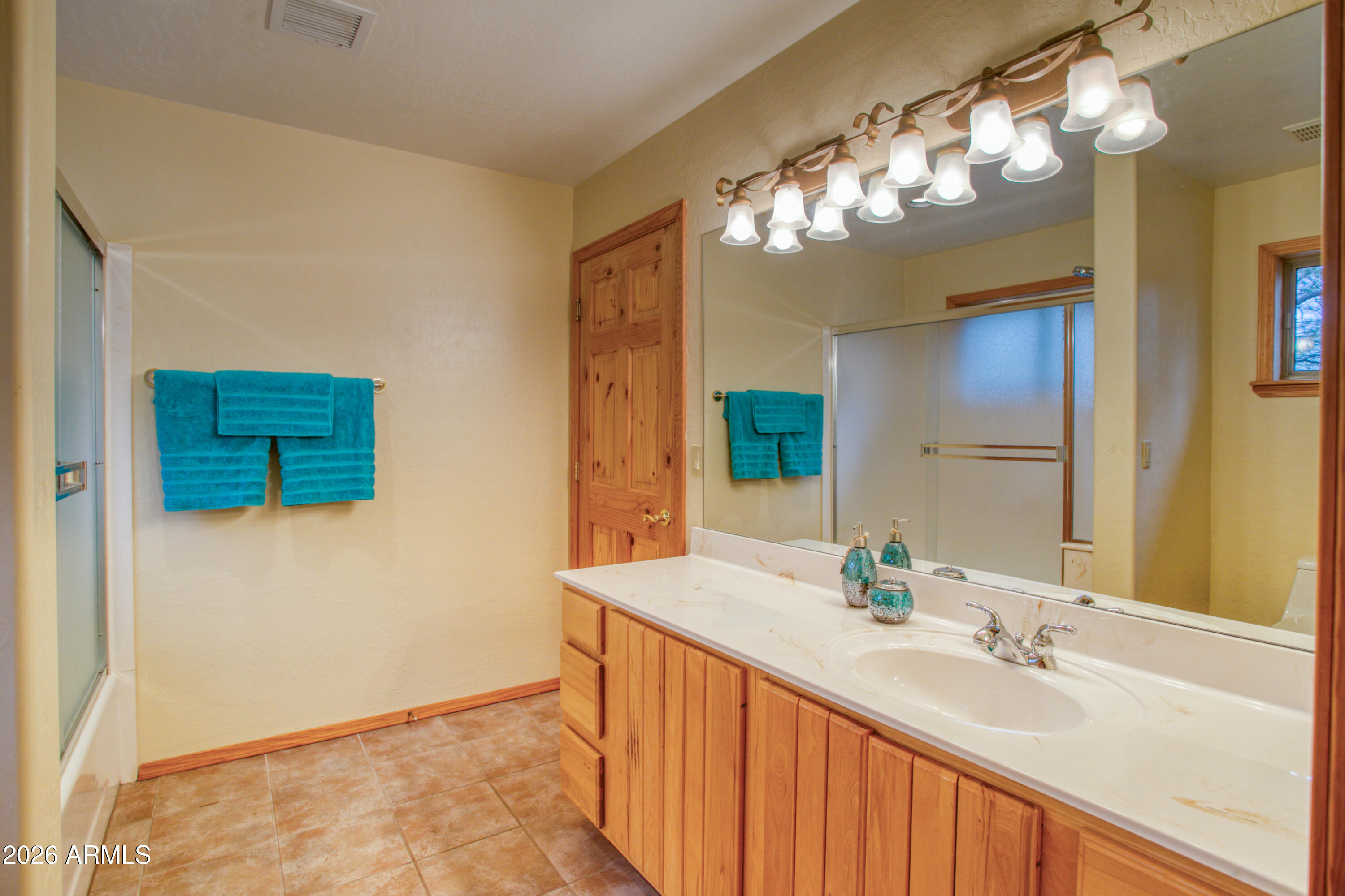 826 Pine Creek Circle Lakeside, AZ 85929 - Photo 23 of 68 a bathroom with a double vanity sink and a mirror