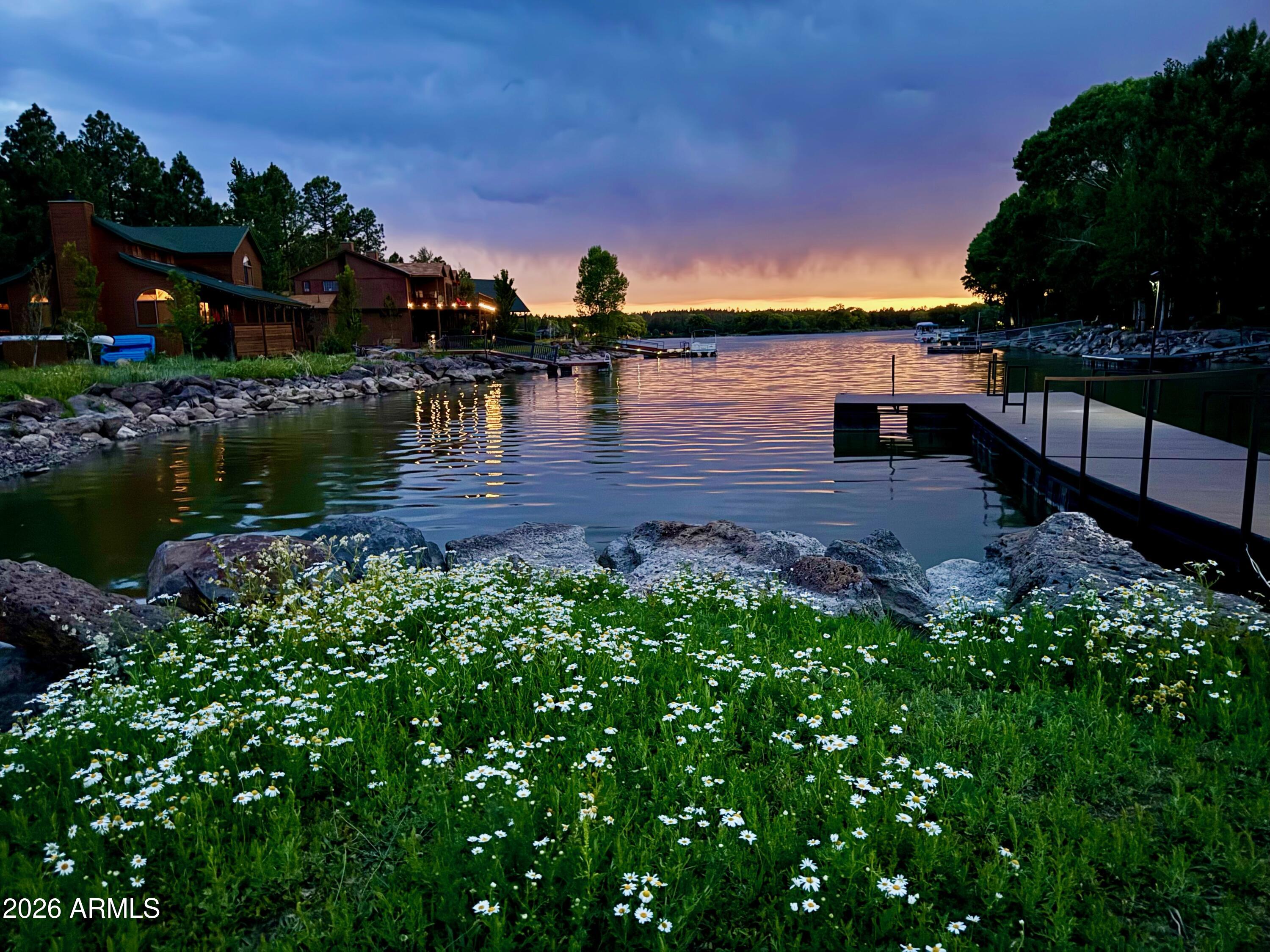 826 Pine Creek Circle Lakeside, AZ 85929 - Photo 47 of 68 a view of a lake with a house in the background