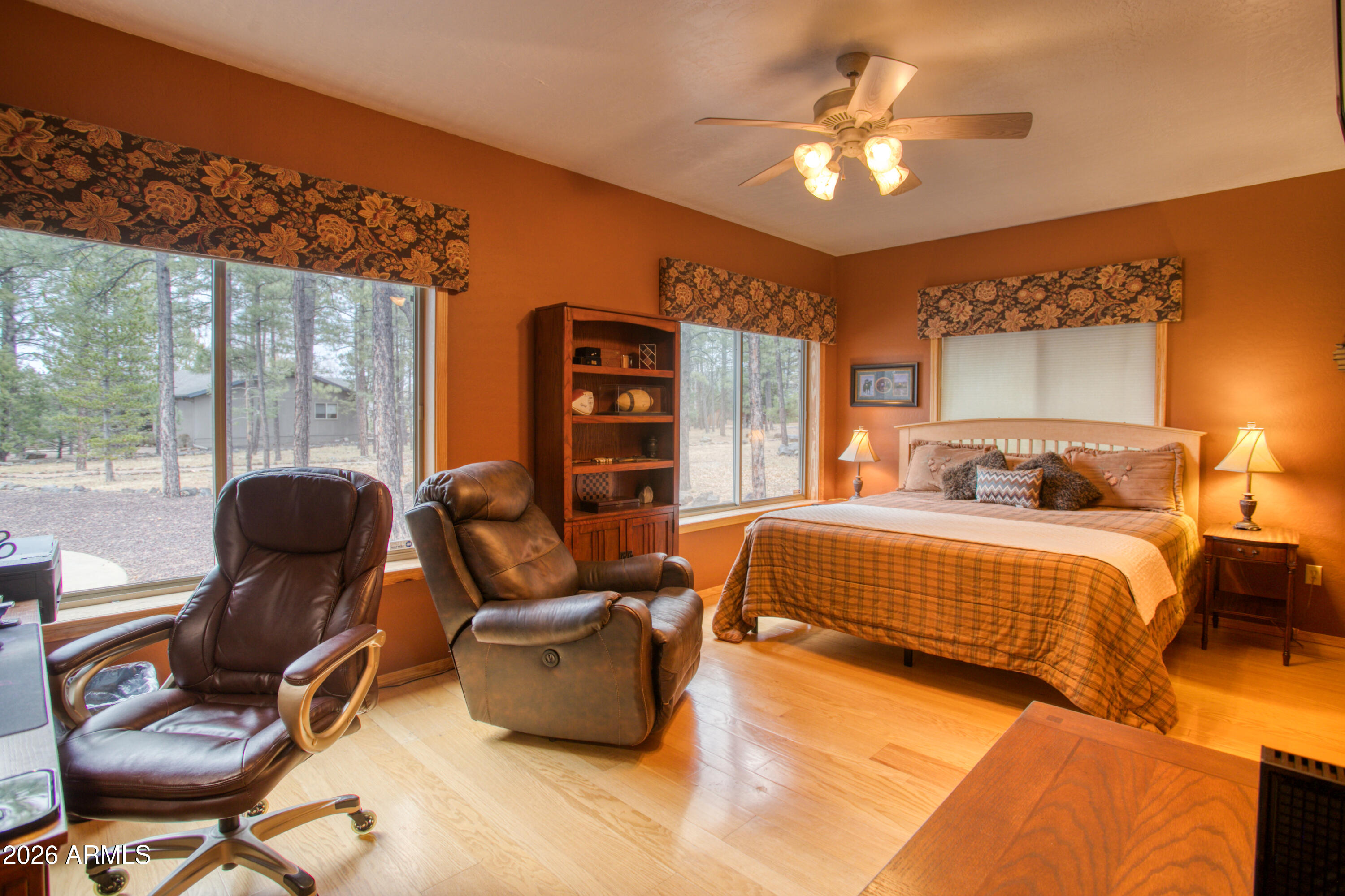 826 Pine Creek Circle Lakeside, AZ 85929 - Photo 6 of 68 a bedroom with a bed and a chandelier