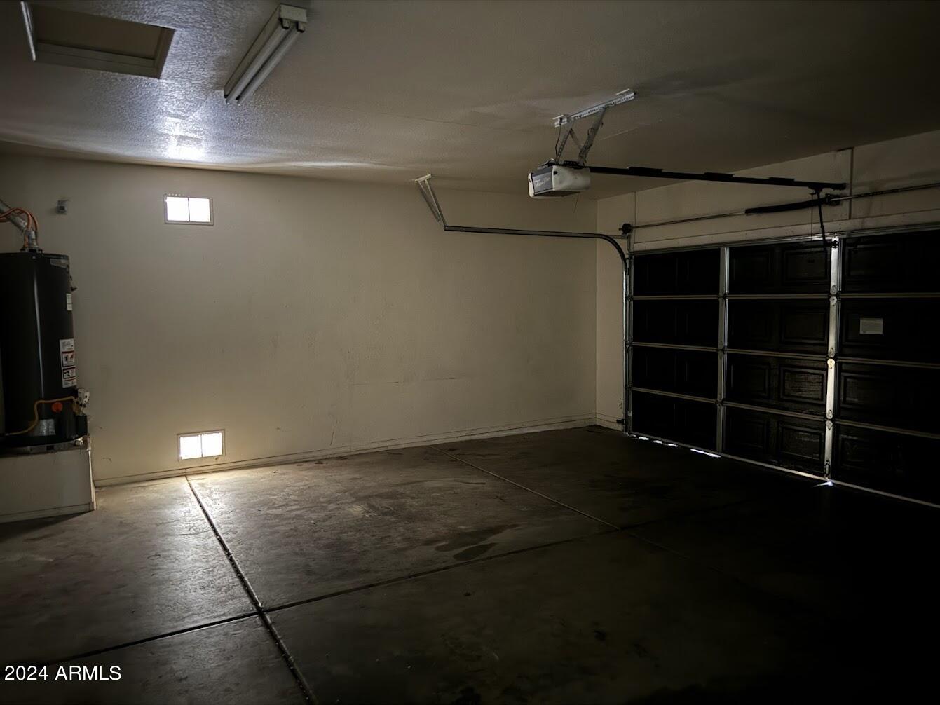 9401 West Berkeley Road Phoenix, AZ 85037 - Photo 23 of 27 a view of an empty room with wooden floor and a window