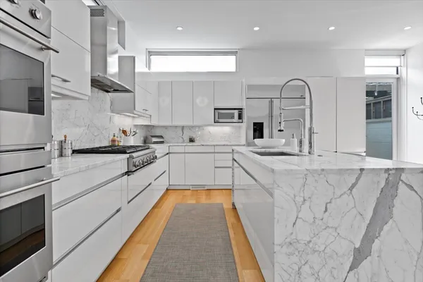 a bed room with a bed and a book shelf