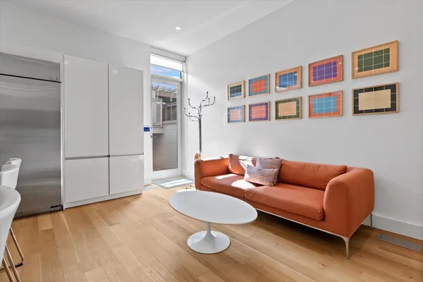 a bathroom with a toilet sink vanity tub and shower