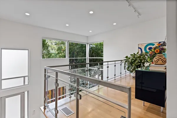 a bedroom with a workspace and a couch