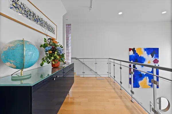 a bedroom with a bed couch and painting on the wall