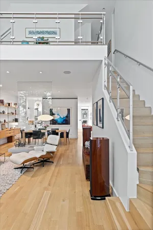 a living room with furniture potted plant and a window