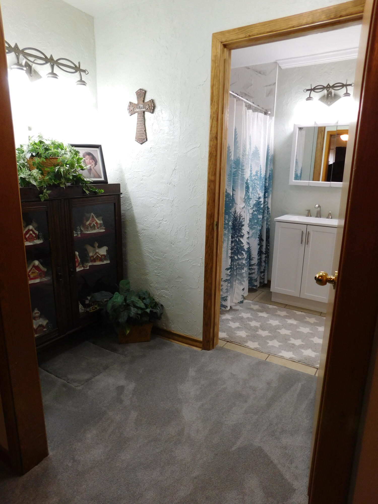 122 West 16th Street Muleshoe, TX 79347 - Photo 19 of 27 a view of a bathroom from a hallway