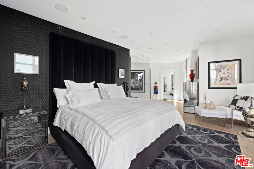 1 West Century Drive, Unit 5B Los Angeles, CA 90067 - Photo 11 of 21 a bedroom with bed and wooden floor