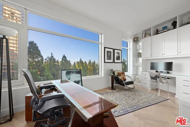 a very nice looking dining room with a large window