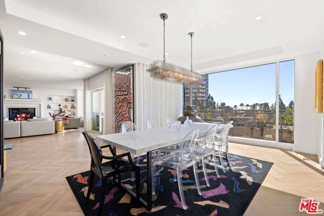 1 West Century Drive, Unit 5B Los Angeles, CA 90067 - Photo 8 of 21 a view of a dining room with furniture window and wooden floor