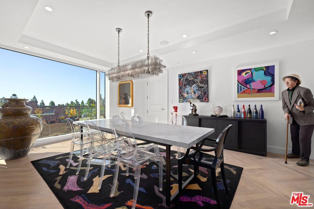 1 West Century Drive, Unit 5B Los Angeles, CA 90067 - Photo 9 of 21 a view of a dining room with furniture and chandelier